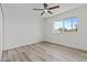 A comfortable bedroom offers neutral tones, modern floors, and bright natural light at 2106 W 8Th Ave, Mesa, AZ 85202
