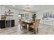 Bright dining room with a stylish chandelier, a dry bar, and sliding glass doors to the backyard at 2106 W 8Th Ave, Mesa, AZ 85202