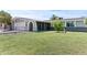Well-kept single-story home featuring a lush green lawn and charming curb appeal at 2106 W 8Th Ave, Mesa, AZ 85202