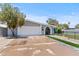 Inviting single-story home featuring an attached garage and well-maintained front yard at 2106 W 8Th Ave, Mesa, AZ 85202