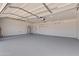 Spacious garage featuring neutral paint, sealed concrete, and a water heater at 2106 W 8Th Ave, Mesa, AZ 85202