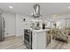 Open-concept kitchen island featuring stainless steel appliances and barstool seating at 2106 W 8Th Ave, Mesa, AZ 85202