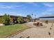 Spacious backyard featuring a patio with seating and a well-maintained lawn, perfect for outdoor gatherings at 2118 W Cactus Wren Dr, Phoenix, AZ 85021