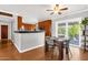 Eat-in kitchen with hardwood floors and patio access bringing the outdoors in at 2118 W Cactus Wren Dr, Phoenix, AZ 85021