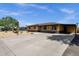Single story home featuring a low maintenance desert landscape, covered parking, and stone accents at 2118 W Cactus Wren Dr, Phoenix, AZ 85021