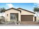 Charming single-story home features a two-car garage, neutral stucco, and tiled roof at 2123 E Mill Rd, San Tan Valley, AZ 85140