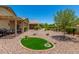 Picturesque backyard with gravel landscaping, mature trees, and a peaceful, inviting atmosphere at 22403 W Harrison St, Buckeye, AZ 85326