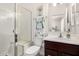 Bathroom featuring a walk-in shower with glass door, vanity and sink at 22403 W Harrison St, Buckeye, AZ 85326