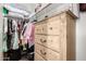 Walk-in closet with shelving and drawers for ample storage at 22403 W Harrison St, Buckeye, AZ 85326