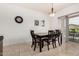 Bright dining area featuring a wooden table and chairs, light fixture, and sliding glass door for outdoor access at 22403 W Harrison St, Buckeye, AZ 85326