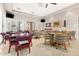 Game room featuring tables, chairs, and entertainment options for residents at 22403 W Harrison St, Buckeye, AZ 85326