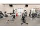Well-equipped gym featuring a variety of machines and equipment for a complete workout at 22403 W Harrison St, Buckeye, AZ 85326