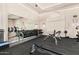 Bright gym featuring free weights, exercise machines, and mirrored wall at 22403 W Harrison St, Buckeye, AZ 85326