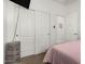 Main bedroom with sliding closet doors and ensuite bathroom at 22403 W Harrison St, Buckeye, AZ 85326