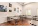 Inviting meeting room featuring multiple tables and chairs complemented by tasteful artwork on the walls at 22403 W Harrison St, Buckeye, AZ 85326