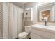 Bathroom featuring a clean white vanity, toilet, and a shower with a patterned curtain at 2520 N 15Th St, Phoenix, AZ 85006