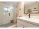 Modern bathroom with a glass-enclosed shower, white vanity, and neutral color scheme at 2520 N 15Th St, Phoenix, AZ 85006