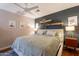 Cozy bedroom featuring a large bed, ceiling fan, and decorative wall art at 2520 N 15Th St, Phoenix, AZ 85006