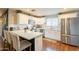 Bright kitchen featuring a large island with seating, stainless appliances, and ample cabinet space at 2520 N 15Th St, Phoenix, AZ 85006
