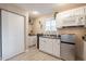Kitchenette area with appliances, white cabinets and a window providing natural light at 2520 N 15Th St, Phoenix, AZ 85006