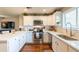 Bright kitchen with white cabinets, stainless steel appliances, and hardwood floors at 2520 N 15Th St, Phoenix, AZ 85006