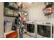 Functional laundry room with modern washer and dryer, and metal storage racks at 2520 N 15Th St, Phoenix, AZ 85006
