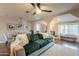 Cozy living room featuring a comfortable green couch, hardwood floors, and stylish decor at 2520 N 15Th St, Phoenix, AZ 85006