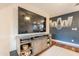 Stylish living room showcasing a modern TV stand and unique wall decor at 2520 N 15Th St, Phoenix, AZ 85006