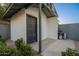 Exterior of detached outbuilding with a gray door, a concrete slab, and a blue sky at 2520 N 15Th St, Phoenix, AZ 85006