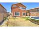 Spacious backyard offering a play area, a patio, a slide, and plenty of space for outdoor activities at 25519 W Crown King Rd, Buckeye, AZ 85326