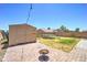 Backyard featuring a shed, fire pit, swing, trampoline, and ample space for outdoor enjoyment and storage at 25519 W Crown King Rd, Buckeye, AZ 85326