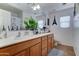 Bathroom with double sinks, cabinets for storage, mirrors, and decor that enhances the space's appeal at 25519 W Crown King Rd, Buckeye, AZ 85326