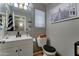 Cozy bathroom featuring a vanity with black hardware, and decor that adds a stylish touch at 25519 W Crown King Rd, Buckeye, AZ 85326