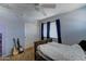 Bedroom featuring a bed, ceiling fan, closet, and guitar decor to add a personal touch at 25519 W Crown King Rd, Buckeye, AZ 85326