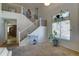 Open entryway features a staircase, neutral colors, and a window with natural light at 25519 W Crown King Rd, Buckeye, AZ 85326