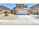 Charming two-story home with a stone-accented facade and a well-maintained front yard at 25519 W Crown King Rd, Buckeye, AZ 85326