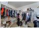 Spacious walk-in closet with custom shelving and ample storage for clothes and shoes at 25519 W Crown King Rd, Buckeye, AZ 85326