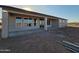 Outdoor patio featuring a concrete slab and exterior lighting, perfect for relaxing at 28151 N Faded Creek Dr, Florence, AZ 85132