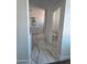 Hallway view of stylish bathroom featuring elegant marble floors, modern vanity and separate toilet room at 28151 N Faded Creek Dr, Florence, AZ 85132