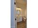 Well-lit half bathroom with tile flooring, modern vanity, and mirror at 28151 N Faded Creek Dr, Florence, AZ 85132