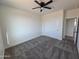 Comfortable bedroom with carpet, a ceiling fan, and a closet at 28151 N Faded Creek Dr, Florence, AZ 85132