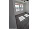 Bedroom featuring two large windows offering natural light and carpet at 28151 N Faded Creek Dr, Florence, AZ 85132