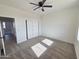Bedroom featuring carpet, ceiling fan, and a closet at 28151 N Faded Creek Dr, Florence, AZ 85132