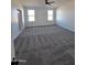 Large bedroom featuring plush carpeting, recessed lighting and windows that provide natural light at 28151 N Faded Creek Dr, Florence, AZ 85132
