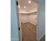 Spacious walk-in closet with wood-look floors and custom shelving for optimal storage at 28151 N Faded Creek Dr, Florence, AZ 85132