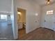 Bright entry hallway leading to kitchen and bathroom at 28151 N Faded Creek Dr, Florence, AZ 85132