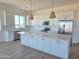 Bright kitchen with quartz countertops, white subway tile backsplash, and stainless steel appliances at 28151 N Faded Creek Dr, Florence, AZ 85132