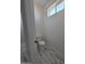 Toilet room with marble floors and small window allowing natural light at 28151 N Faded Creek Dr, Florence, AZ 85132