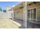 View of a covered back patio that opens onto the grassy yard, offering a space for relaxation at 3415 N 36Th St # 3, Phoenix, AZ 85018