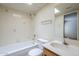 Bathroom featuring bathtub, floral tiling, skylight and vanity sink at 3415 N 36Th St # 3, Phoenix, AZ 85018